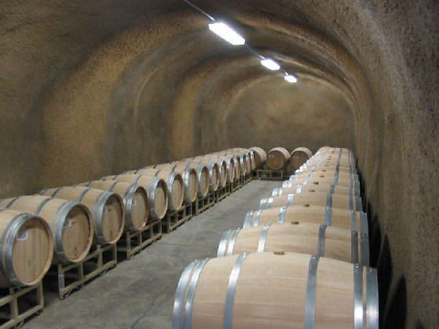 Barrels of wine aging in a Napa Valley cellar. Napa County gained 700 farm jobs over the year, but beverage and tobacco product manufacturing, which includes wineries, declined by 300 jobs, or 2.4 percent.